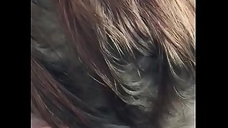 Young redhead sucking black dick