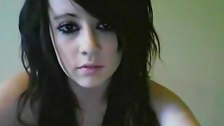 Dark-haired emo is poking her shaved pussy