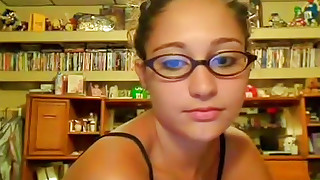 Babe in cute glasses is fucking on the webcam