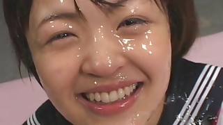 Cute Asian babe gets loads of cum over her face